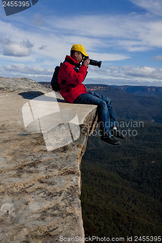 Image of Tourist or photographer taking phots mountain landscape