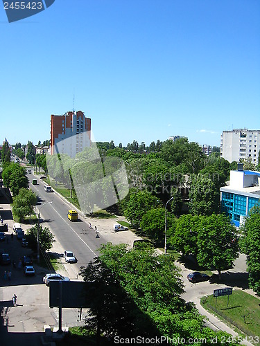 Image of Panorama of city with multystorey houses and trees