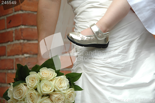 Image of Bride, child and flowers