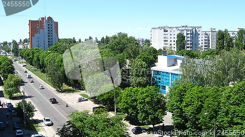 Image of Panorama of city with multystorey houses and trees