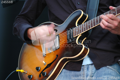 Image of Playing guitar