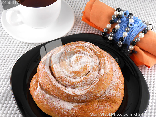 Image of tea with cake and gift bow