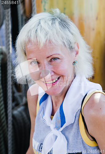 Image of Portrait of a cheerful woman on sailboat  
