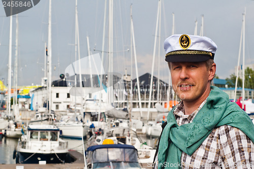 Image of Portrait of a man in a sailor's Cap on the deck of a sailboat