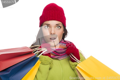 Image of Mixed Race Woman Wearing Hat and Gloves Holding Shopping Bags