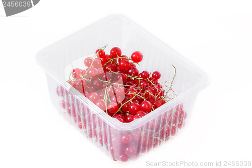 Image of pile berries of red currant on white background