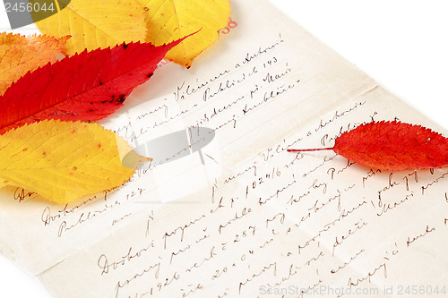 Image of handwritten letter with autumn leaves