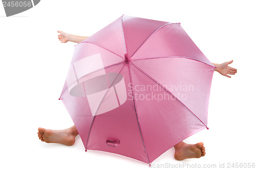 Image of pink umbrella over child
