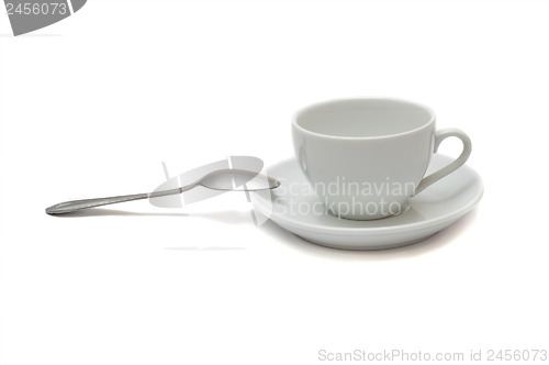 Image of white cup with spoon and saucer isolated on white background