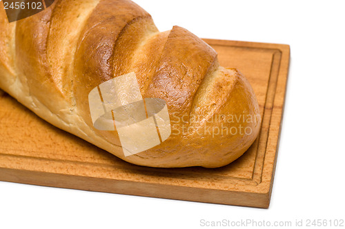 Image of bread on breadboard isolated on white background