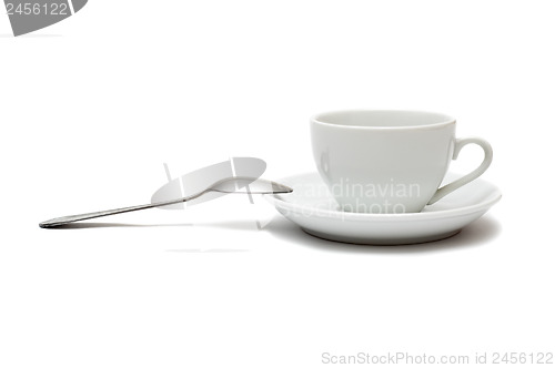 Image of white cup with spoon and saucer isolated on white background