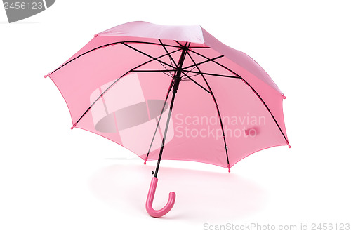 Image of pink umbrella over white