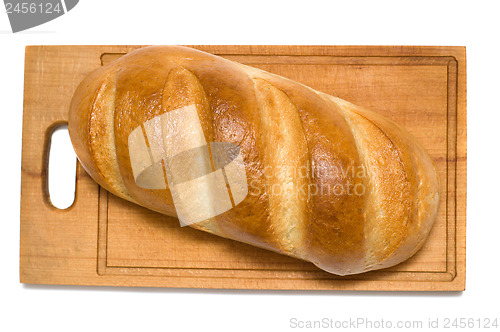 Image of bread on breadboard isolated on white background
