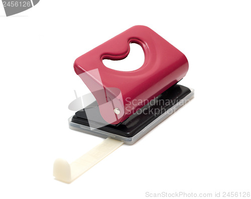 Image of hole puncher with a ruler isolated on white background