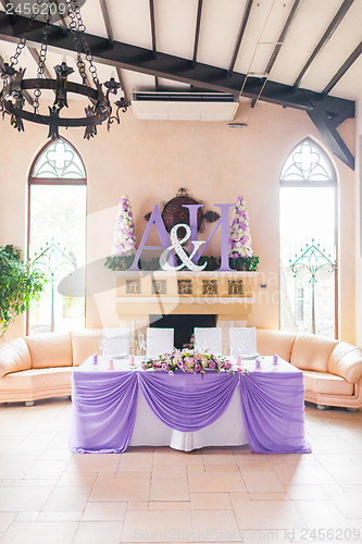 Image of Bride and groom's table decorated with flowers