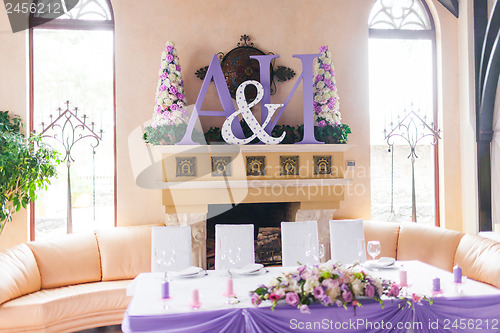 Image of Bride and groom's table decorated with flowers