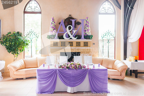 Image of Bride and groom's table decorated with flowers