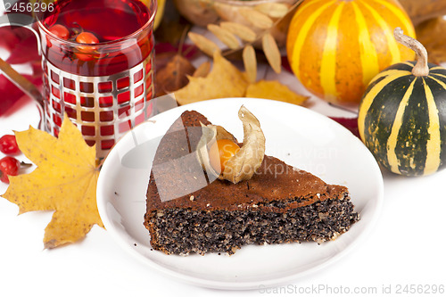 Image of poppy pie, autumn leaves and pumpkins