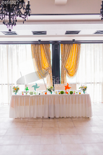 Image of tables decorated with flowers and fruit