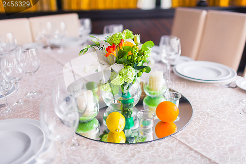 Image of tables decorated with flowers and fruit