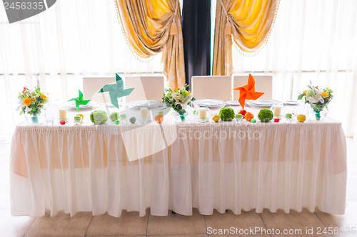 Image of tables decorated with flowers and fruit