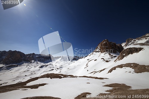 Image of Snowy plateau and blue sky with sun