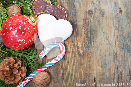 Image of Ginger biscuits, Christmas balls and candy.