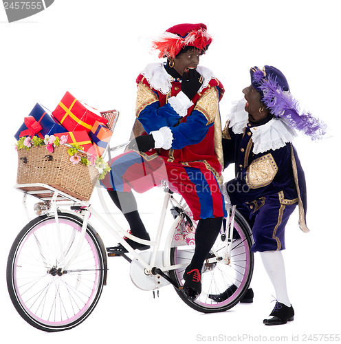 Image of Zwarte Piet on a bike with presents