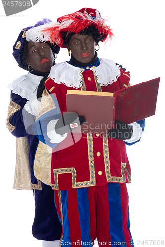 Image of Zwarte Piet and the book of Sinterklaas