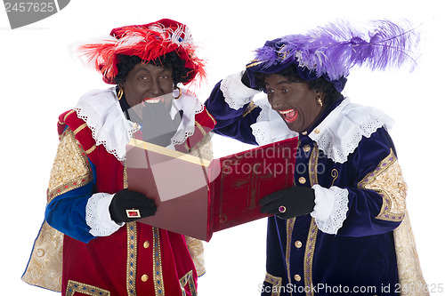 Image of Zwarte Piet and the book of Sinterklaas