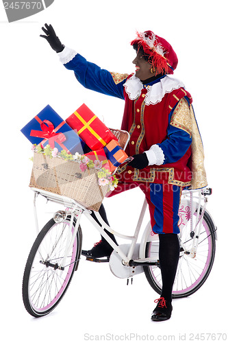 Image of Zwarte Piet on a bike with presents