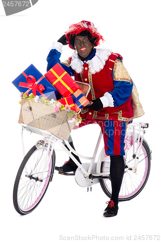 Image of Zwarte Piet on a bike with presents