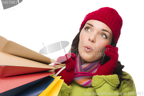 Image of Mixed Race Woman Holding Shopping Bags On Cell Phone Looking