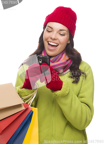 Image of Mixed Race Woman Holding Shopping Bags Texting On Cell Phone 