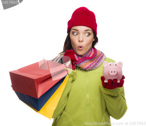 Image of Concerned Mixed Race Woman Holding Shopping Bags and Piggybank