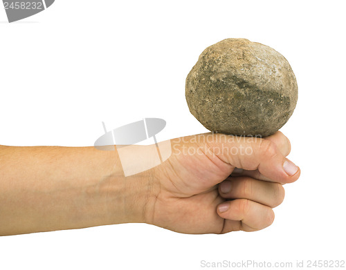 Image of Hand holding stone ball