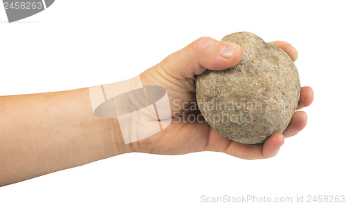 Image of Hand holding stone ball