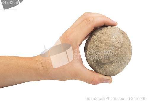 Image of Hand holding stone ball