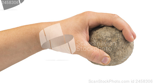 Image of Hand holding stone ball