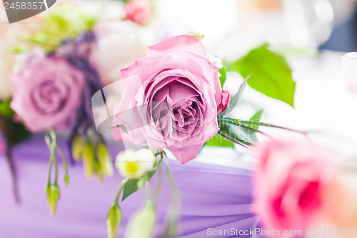 Image of Tables decorated with flowers. Closeup details