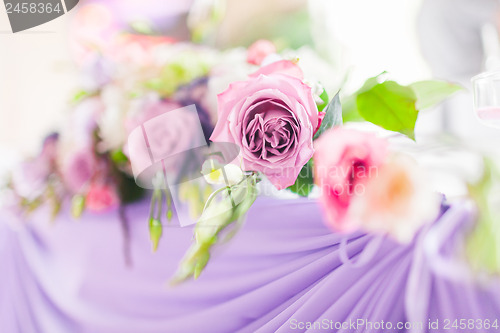 Image of Tables decorated with flowers. Closeup details