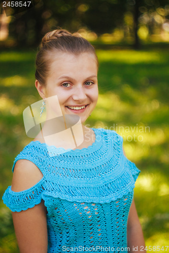 Image of Beautiful young girl in the park 