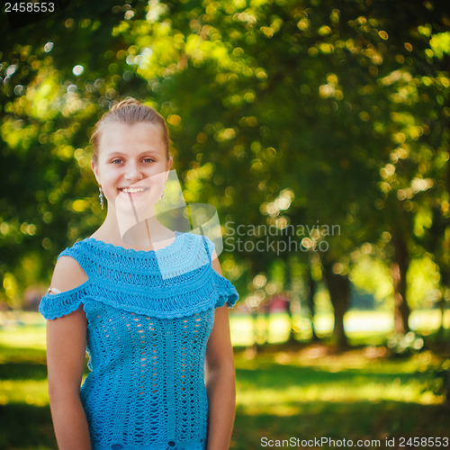 Image of Beautiful young girl in the park 