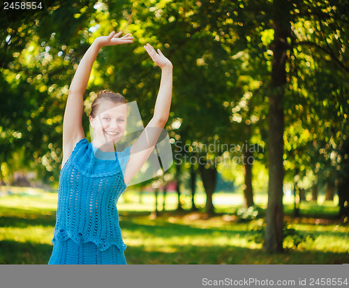 Image of Beautiful young girl in the park 