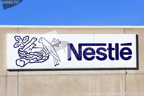 Image of Sign Nestle with Blue Sky