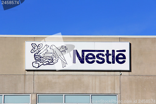 Image of Sign Nestle with Blue Sky