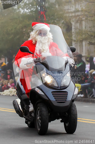 Image of Santa Claus on   scooter