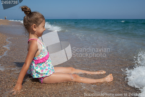 Image of Happy little girl and sea