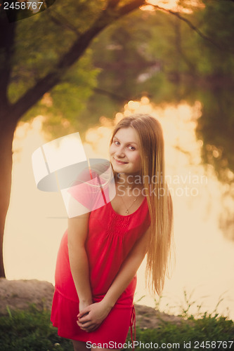 Image of Beautiful Young Girl Standing On Park