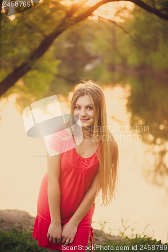 Image of Beautiful Young Girl Standing On Park